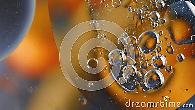 Bubbles rising in a colorful liquid under ambient light creating a mesmerizing abstract effect Stock Photo