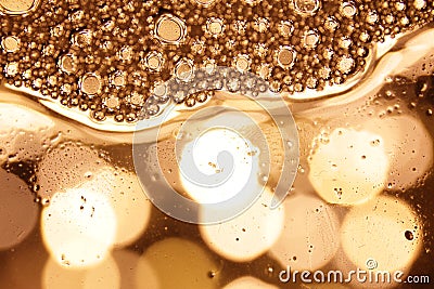 Bubbles in water on gold background horizontal pattern. Circle and liquid, light design Stock Photo