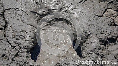 Bubbling mud in a mud volcano. Stock Photo