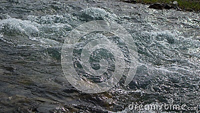 Bubbling water in a boisterous river in a mountainous area. Stock Photo