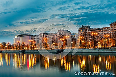 Bucharest city center landscape sunset Splaiul Unirii at dusk Dambovita river Stock Photo