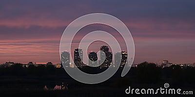 Bucharest night city skyline panorama in Romania capital, with tall buildings and pink, purple twilight colors Stock Photo