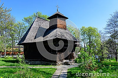 Bucharest, Romania - 25 April 2021: Old traditional Romanian church surounded with many old trees and green grass in Dimitrie Editorial Stock Photo