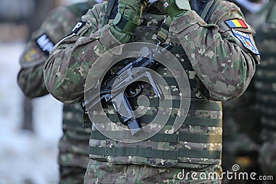 Details with the uniform of a Romanian Military Police soldier, armed with a Micro Uzi Editorial Stock Photo