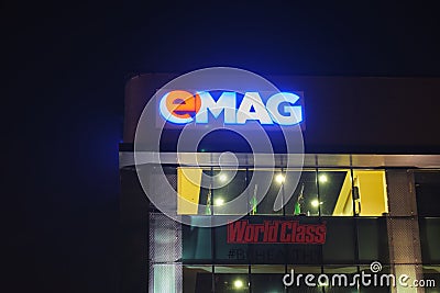 EMAG logo on a building hosting its showroom in Sector 3. Owned by Naspers Limited, eMAG is a Romanian e-commerce company. Editorial Stock Photo