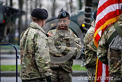 US Army soldiers of the 1st Cavalry Division take part at the Romanian National Day military parade Editorial Stock Photo