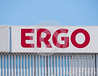 ERGO is a group of insurance companies owned by Munich Re. Company logo against blue sky Editorial Stock Photo