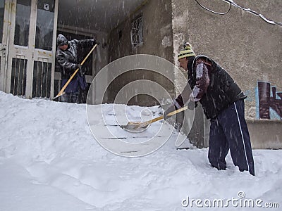 Shoveling snow Editorial Stock Photo