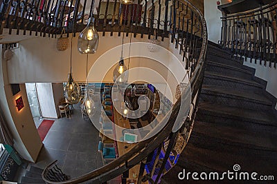 Interior of a luxrious bar with internal wood stair Editorial Stock Photo