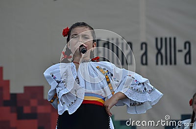 International Folklore Festival: Romanian girl singer in traditional costume Editorial Stock Photo
