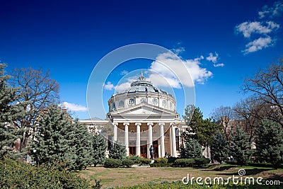 BUCHAREST, ROMANIA - MARCH 18, 2023: Ateneul Roman main facade in front of a park during a sunny afternoon. The Romanian Athenaeum Editorial Stock Photo