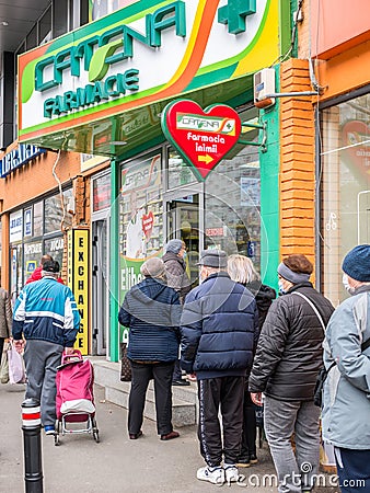 Bucharest/Romania -11.20.2020: Senior people waiting in line at the drugstore. Outside queue at Catena pharmacy Editorial Stock Photo