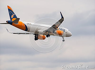 HiSky Airways Airbus A320-200 flying against blue sky. Airplane takes off from Henry Coanda Editorial Stock Photo