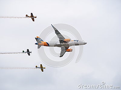 HiSky Airways Airbus A320-200 flying against blue sky. Airplane takes off from Henry Coanda Editorial Stock Photo