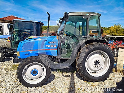 Bucharest, Romania - September 12, 2022: ISEKI Tractor TR63, Employees are presenting the use of a large-scale tractor Editorial Stock Photo