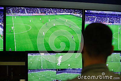 A referee is showing to the press how the video assistant referee VAR system works Editorial Stock Photo