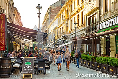 Bucharest, Rumania - 28.04.2018: Tourists in Old Town and Restaurants on Downtown Lipscani Street, one of the most Editorial Stock Photo