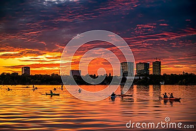 Bucharest sunset on Herastrau lake with kayak , people having relaxing and fun time Editorial Stock Photo