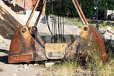 Bucket from the crane, lying on the ground. Repair crane Stock Photo