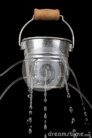 Bucket with holes Stock Photo