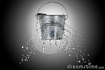 Bucket with holes Stock Photo