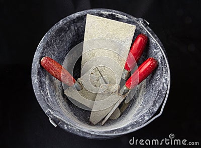 Bucket with masonry tools Stock Photo