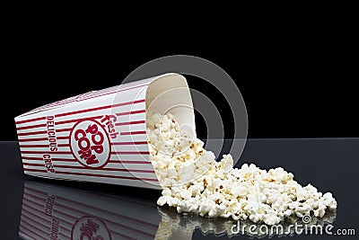 Bucket of spilled popcorn Stock Photo