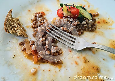 Buckwheat, bread and salad leftovers Stock Photo