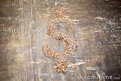 Buckwheat grains in the form of a dollar Stock Photo