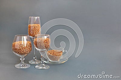 Buckwheat food nutrition diet . buckwheat is poured into wine glasses on a gray background. deficit Stock Photo