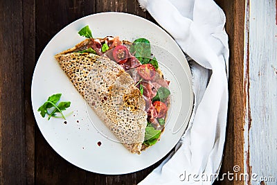 Buckwheat Pancakes with Cherry Tomatoes, Rocket Salad, Spinach, Stock Photo