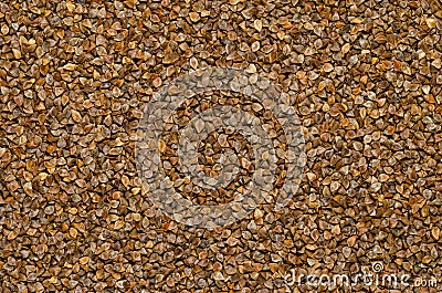 Common buckwheat seeds with husks, surface and background Stock Photo