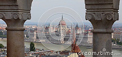 Budapest, B, Hungary - August 18, 2023: Hungarian Parliament building and Danube River between columns Editorial Stock Photo