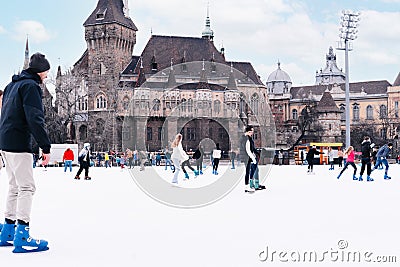 04.01.2022.Budapest.Family winter sport. Soft,Selective focus.Outdoor.Winter sport.Children and adults go ice skating on a winter Editorial Stock Photo