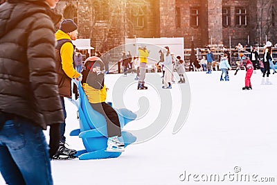 04.01.2022.Budapest.Happy little boy and girl learning to skate in winter.Hobbies and Leisure.Winter sports.Family Editorial Stock Photo