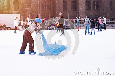 04.01.2022.Budapest.Happy little boy and girl learning to skate in winter.Hobbies and Leisure.Winter sports.Family winter sport. Editorial Stock Photo