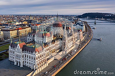 Budapest, Hungary - Aerial drone view of the beautiful Hungarian Parliament building at sunset with warm colors and blue sky Stock Photo