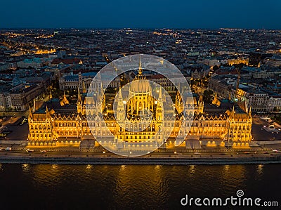 Budapest, Hungary - Aerial view of the beautiful illuminated Parliament of Hungary Orszaghaz at blue hour Stock Photo