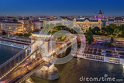 Budapest, Hungary - Aerial view of the beautiful illuminated Szechenyi Chain Bridge with St. Stephen`s Basilica Stock Photo