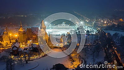 Budapest, Hungary - Aerial view of the beautiful snowy Vajdahunyad Castle in City Park at blue hour Stock Photo