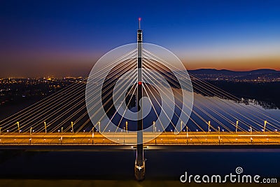 Budapest, Hungary - Aerial view of the illuminated Megyeri Bridge at dusk Stock Photo