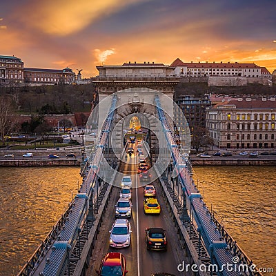 Budapest, Hungary - Aerial view of Szechenyi Chain Bridge with afternoon traffic, beautiful golden sunset sky Editorial Stock Photo