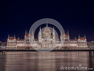 Budapest, Hungary - The beautiful illuminated Hungarian Parliament building Orszaghaz by night with dark blue sky Stock Photo