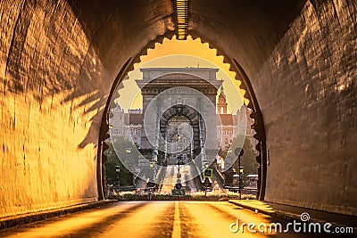 Budapest, Hungary - Entrance of the Buda Castle Tunnel at sunrise with Szechenyi Chain Bridge and Academy of Science Stock Photo