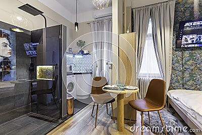 Budapest, Hungary - February 16, 2020: Luxurious tiny home space with a shower cabin outside the bathroom Editorial Stock Photo