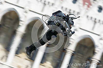 Budapest, Hungary - June 23, 2018: Jet Pack Man flying by Hungarian Parliament Building at Red Bull Air Race Editorial Stock Photo