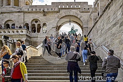 Budapest, Hungary: Tourists climb the stairs to observation deck on of Fishing Bastion. Fisherman`s Bastion is an architectural Editorial Stock Photo