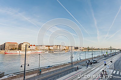 BUDAPEST, HUNGARY - OCTOBER 27, 2015: Landscape of the Bridge and Danube River in Budapest, Hungary. People Are waiting Tram Editorial Stock Photo