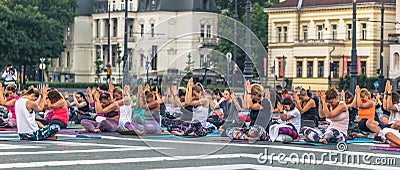 Budapest - June 21, 2019: Yoga event at dawn in Heroes Square in Budapest, Hungary Editorial Stock Photo