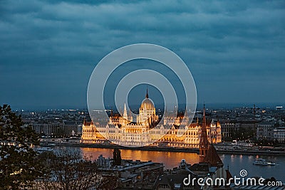 Budapest parliament night yellow illumination river bank Stock Photo